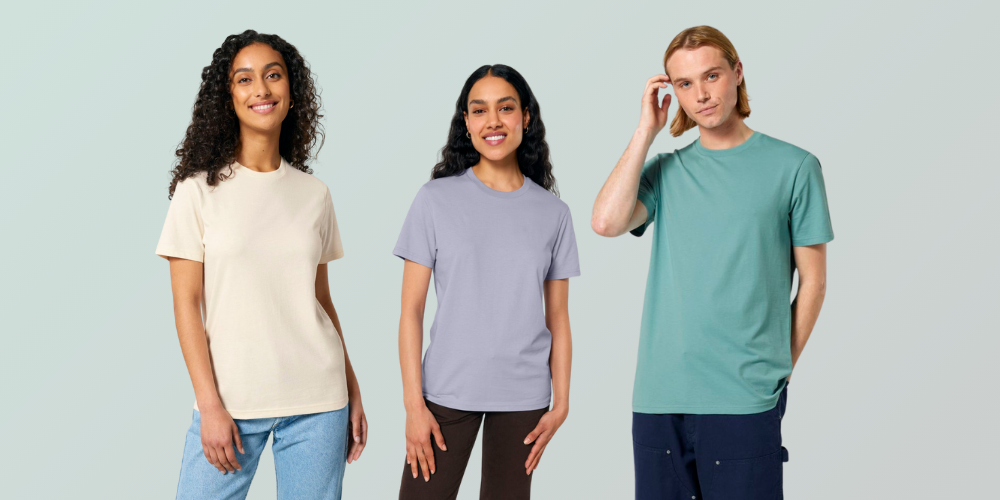 3 people wearing organic cotton t-shirts on a light green background